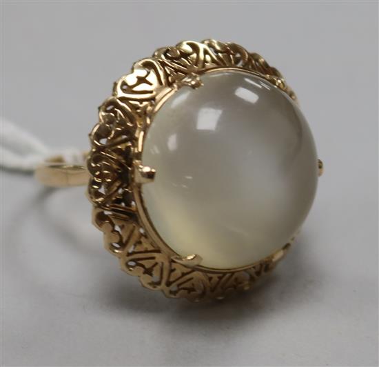 A yellow metal and chatoyant cabochon quartz dress ring, size Q.
